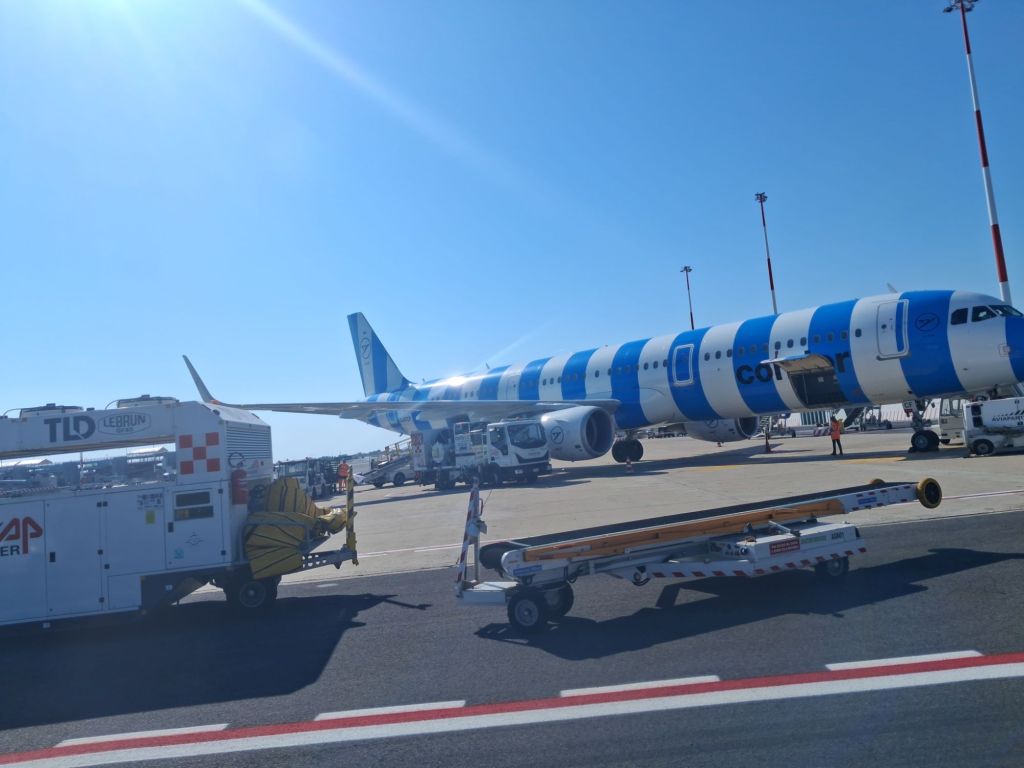 Condor A321 with blue and white stripes parked on stand